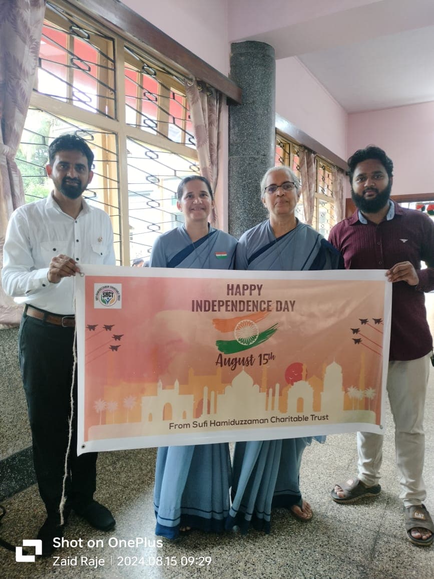 Volunteers holding independence day poster