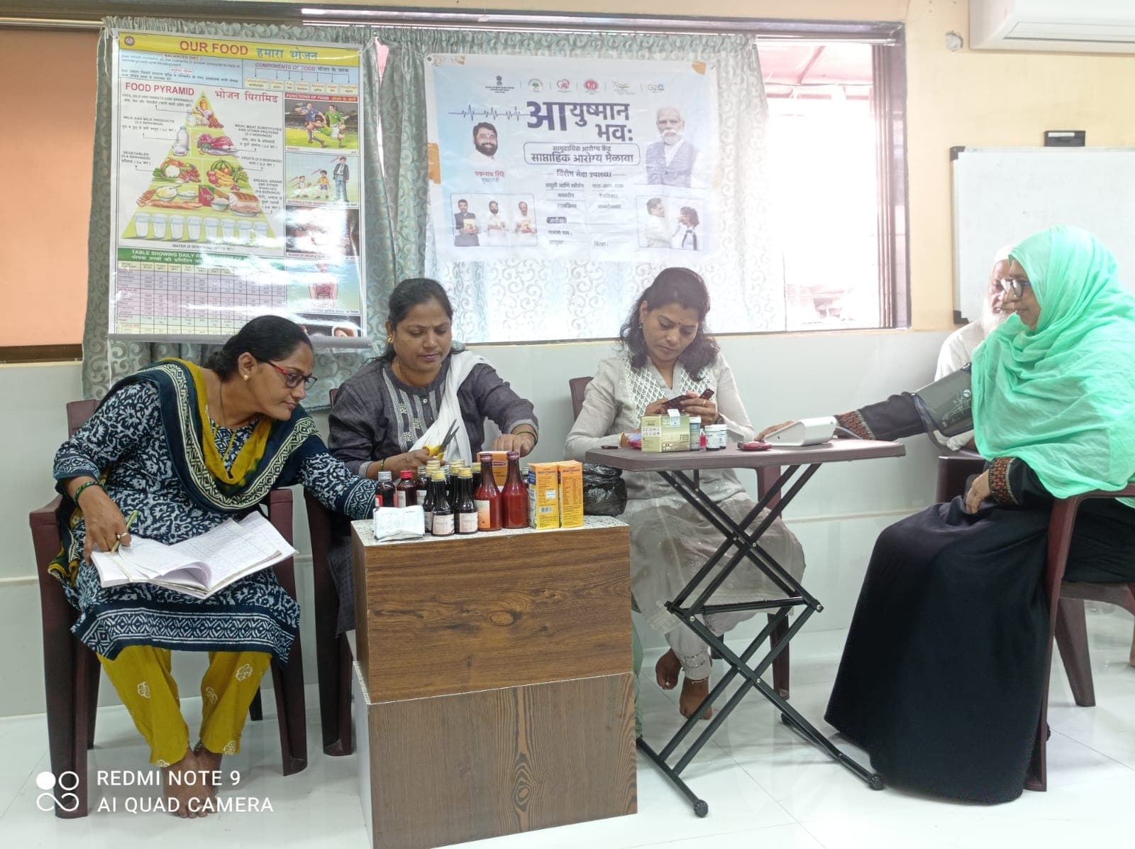 Officials examining patient - view 1